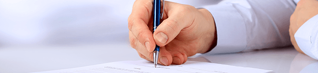 Closeup of man filling out a form