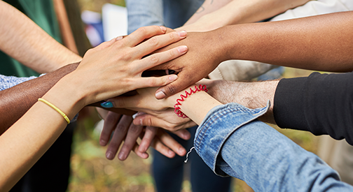 Close-up of hands gathered together