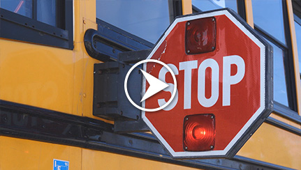 School bus with flashing stop sign